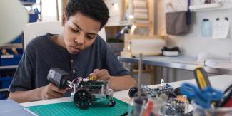 a student working on a robot