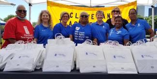 The Cleveland Teachers Union stuffed goody bags with music-themed children’s books and prizes. Volunteers distributed nearly 400 books. From left, Joanne Quinnie, Cheryl West, Christy Rorick-Brown, Cecilia Lee, Wendi Kral, Helen Boru, Cassandra Carter and Kim Bryant-Austin. Photo by Kay Coyte.