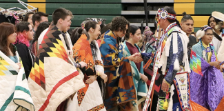 Graduating seniors are honored at the school district’s powwow, Rochester, Minn. Courtesy of Tucker Quetone.